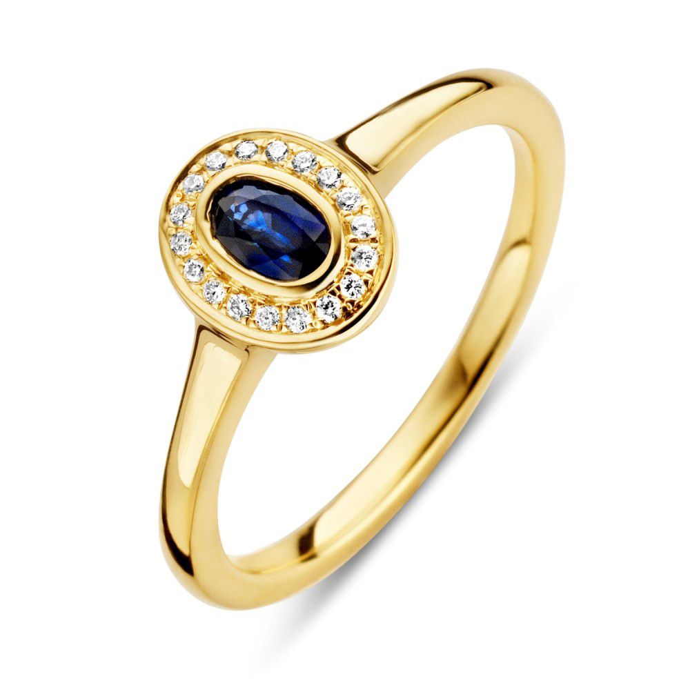 Anello in oro giallo con zaffiro blu ovale e diamanti brillanti incastonati.