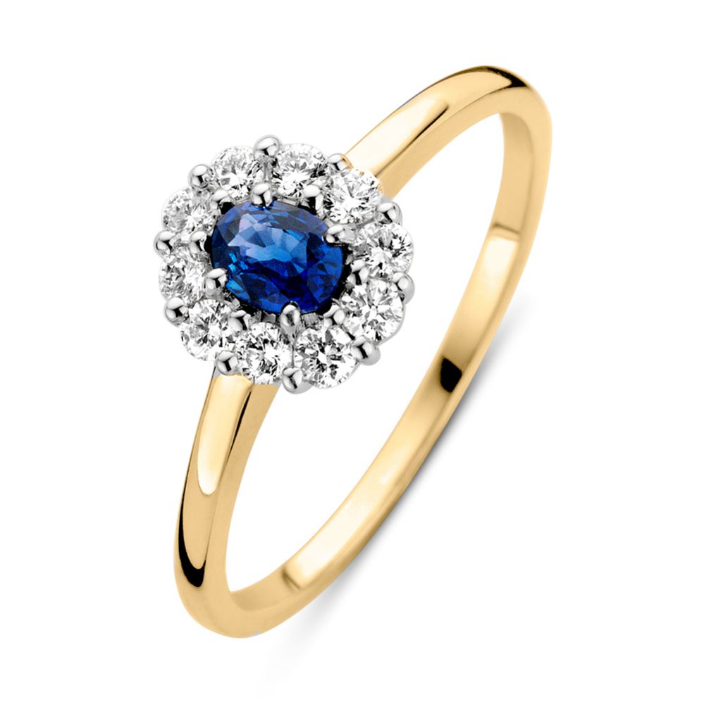 Anello in oro giallo con zaffiro blu e diamanti brillanti.