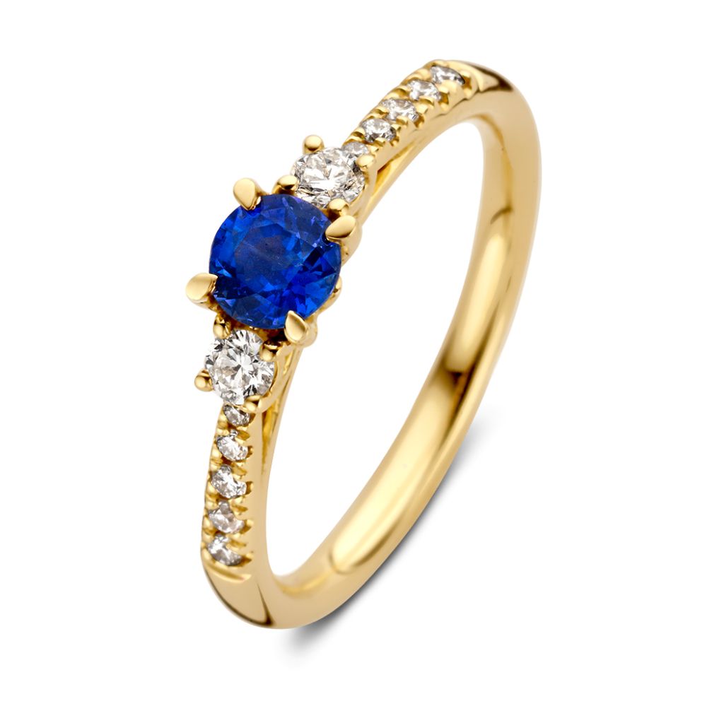 Anello in oro giallo elegante con zaffiro blu e diamanti.