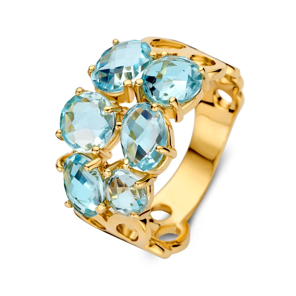 Anello in oro giallo con topazi blu, design organico e finitura lucida, forma larga.