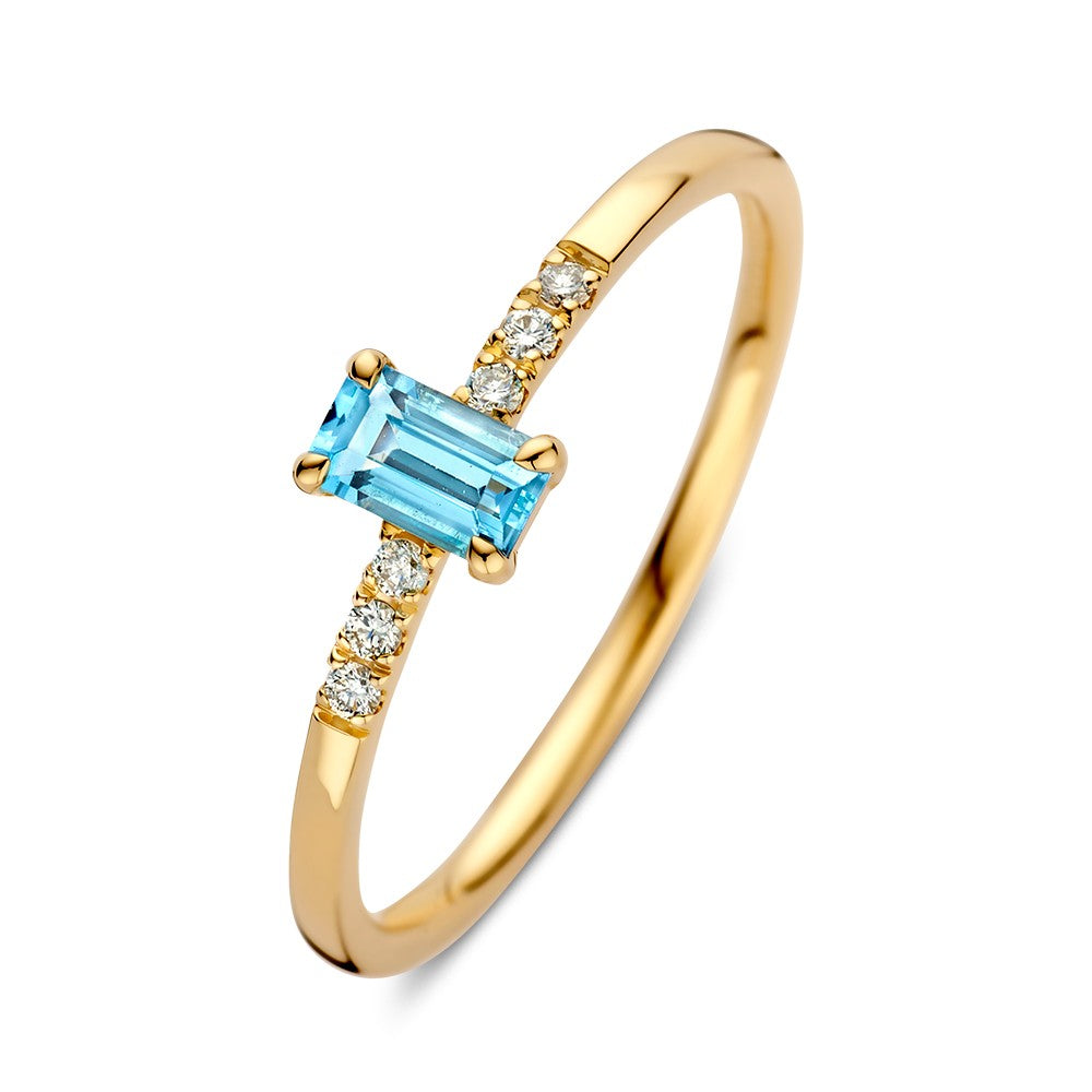 Anello in oro giallo con topazio azzurro e diamanti.