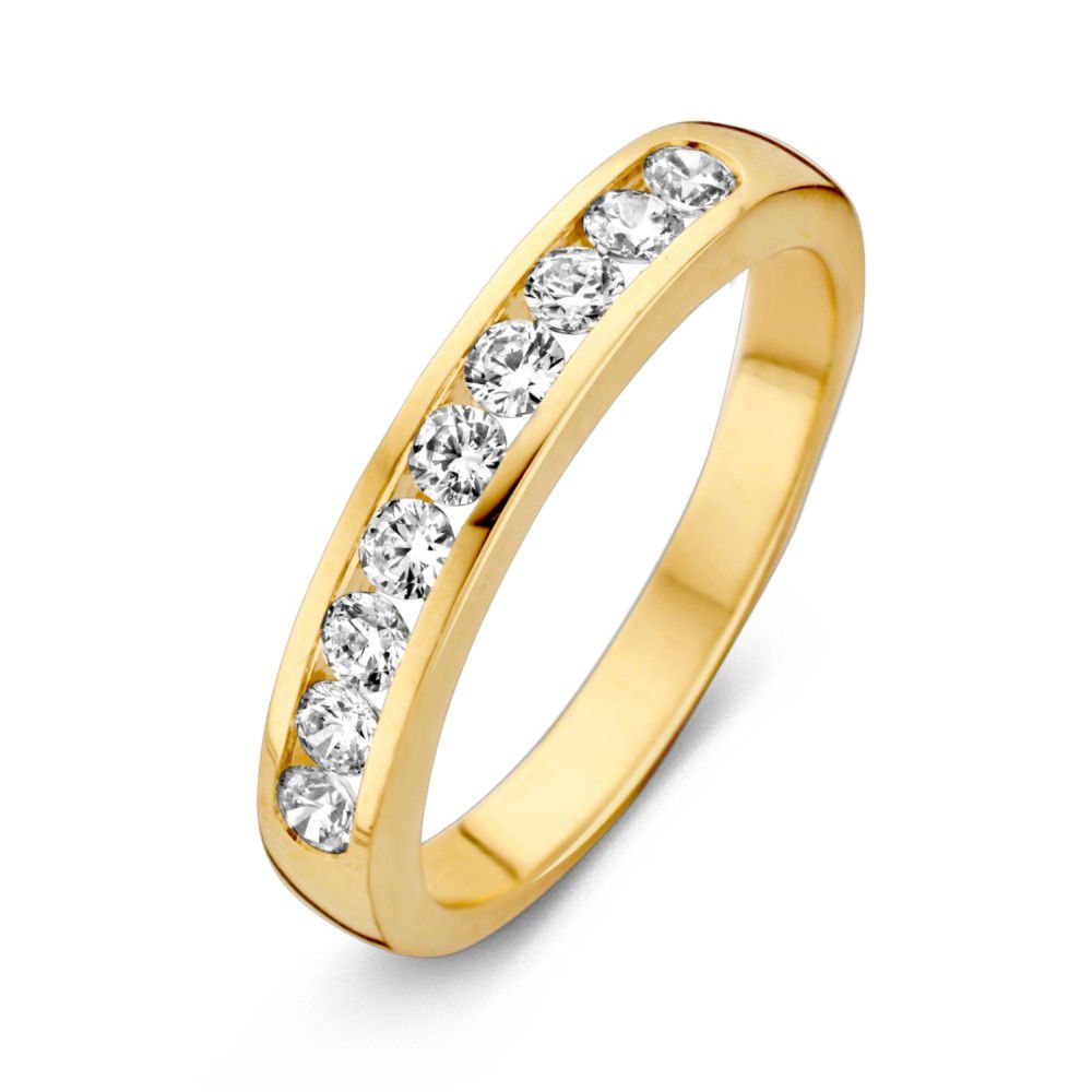 Anello in oro giallo con zircone, design semplice e lineare con pietre brillanti.