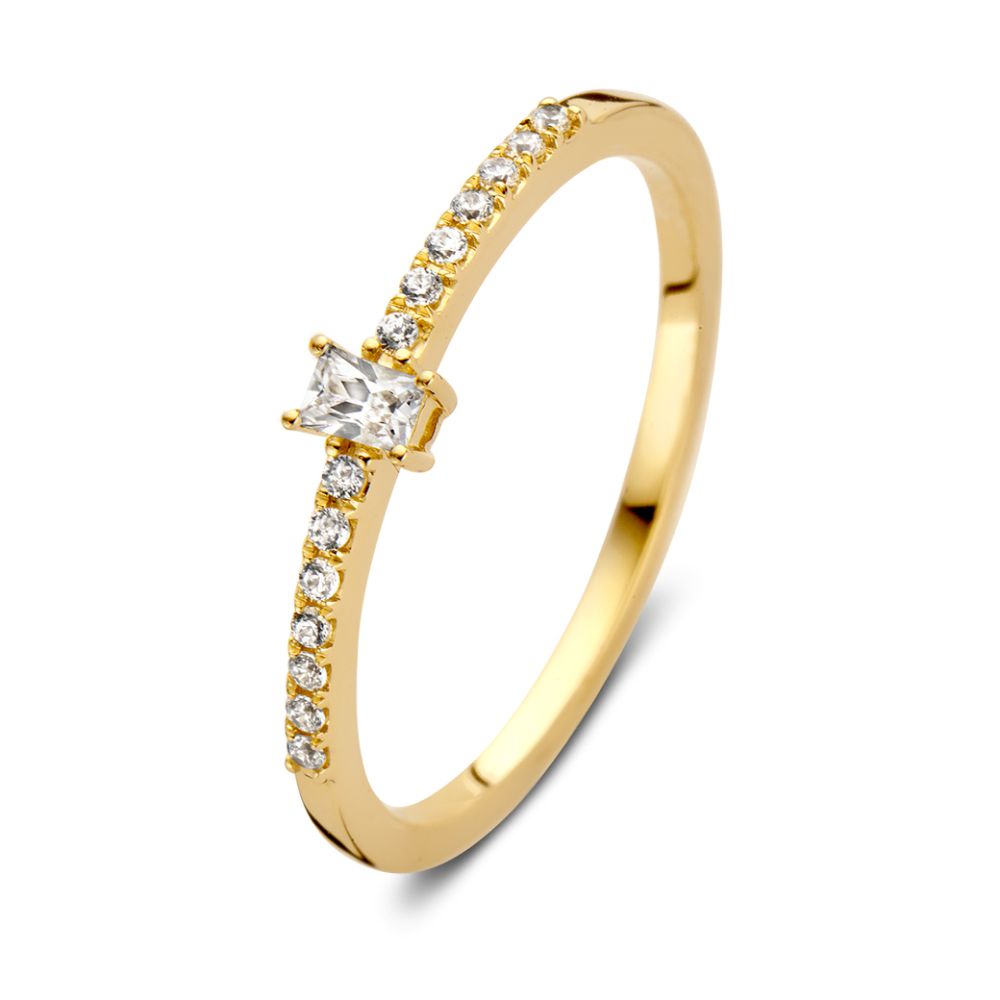 Anello in oro giallo con zirconi e pietra centrale taglio baguette.