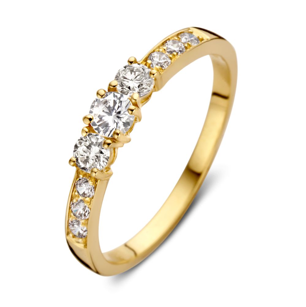 Anello in oro giallo 14 carati con zirconi, design elegante e sottile.