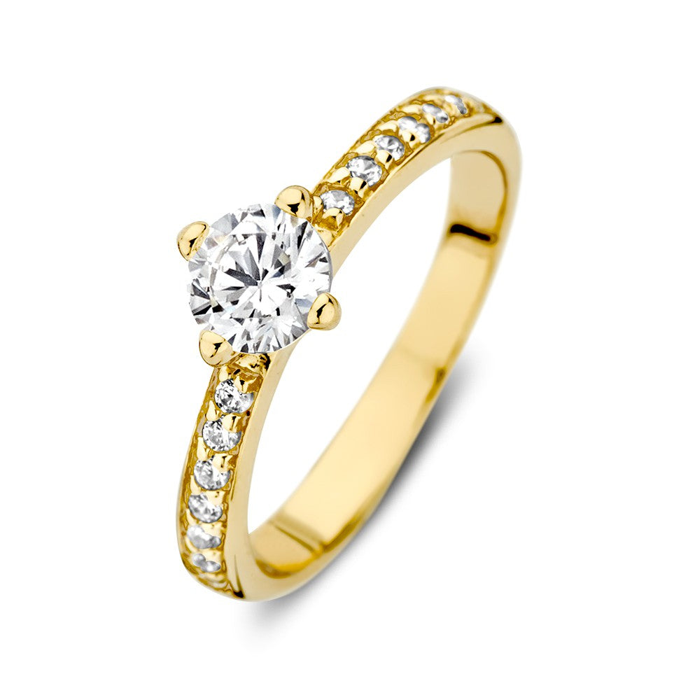 Anello in oro giallo 14 carati con zirconi, design solitario con pietra centrale rotonda.