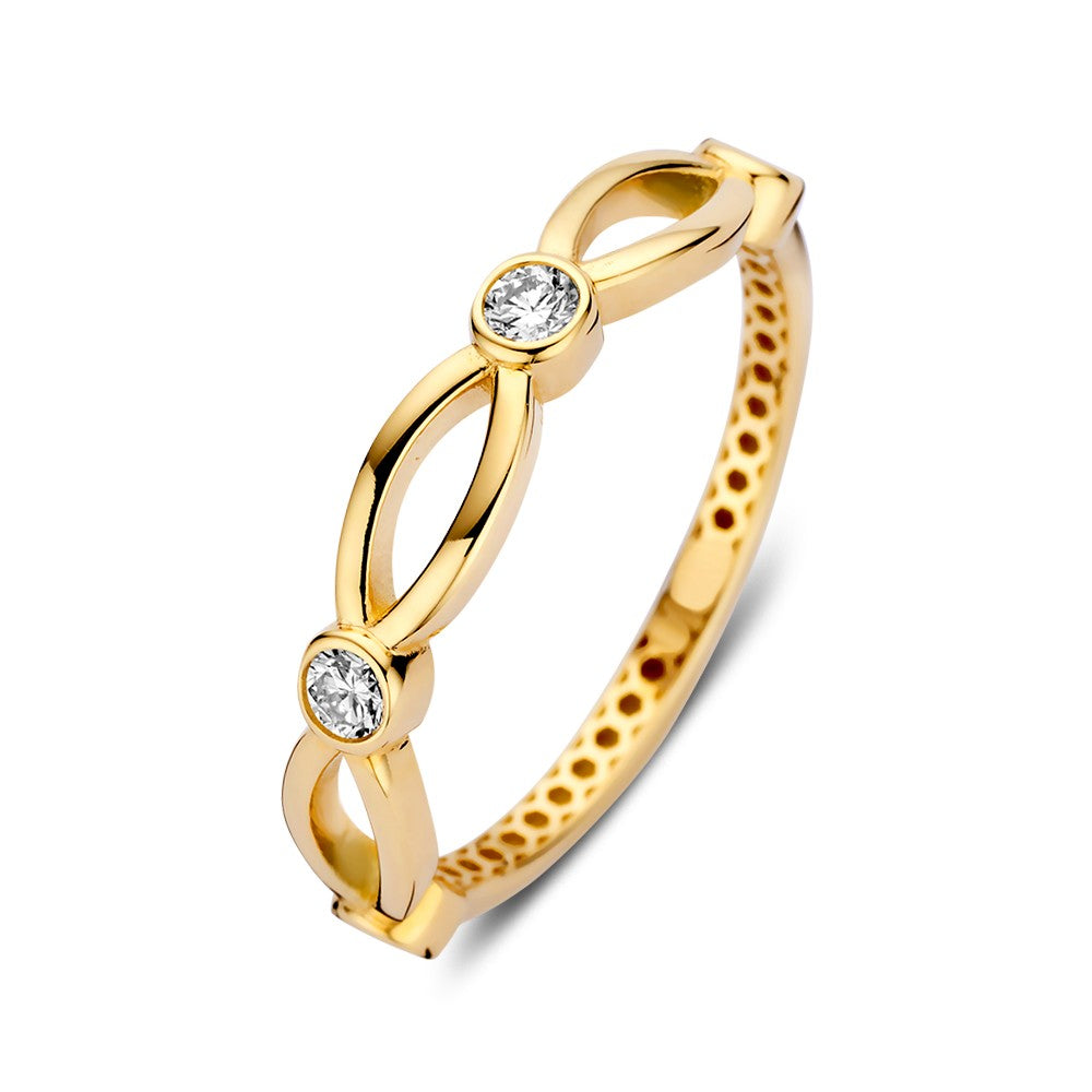 Anello in oro giallo con zircone, design giocoso e sottile, dettagli ondulati.