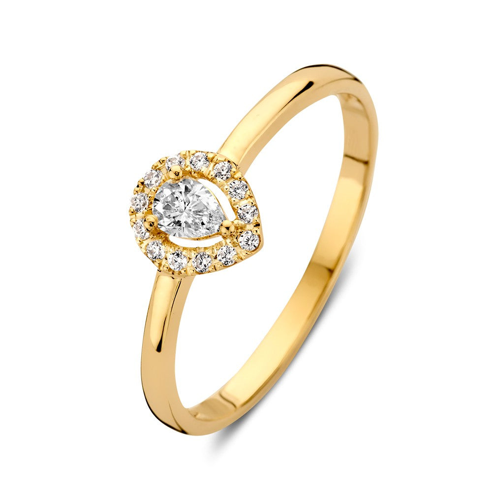 Anello in oro giallo elegante con zircone a forma di pera, decorato con pietre brillanti.