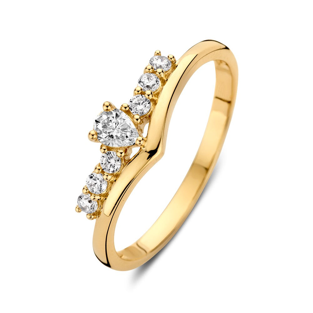 Anello in oro giallo a forma di V con zirconi, caratterizzato da un design moderno e giocoso.