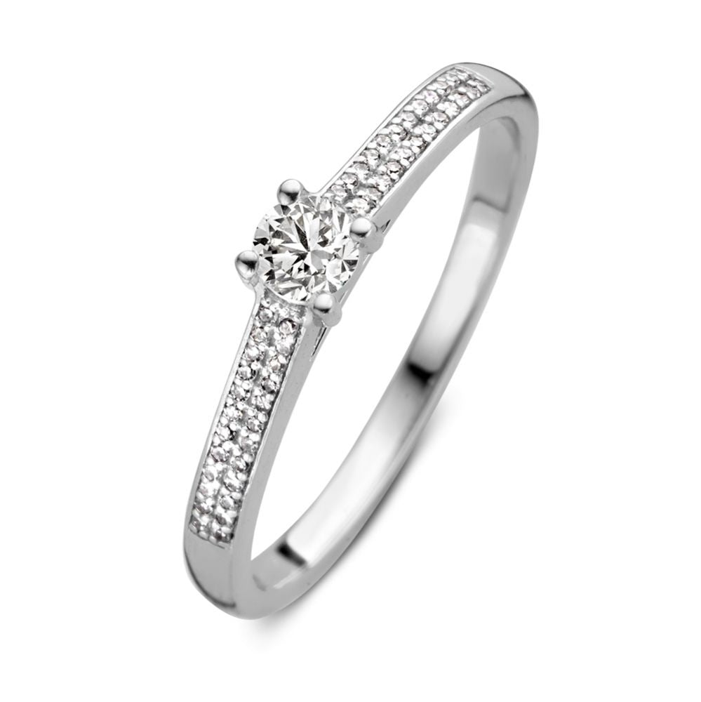 Anello in oro bianco con brillante da 0,27 ct e pavé di diamanti.