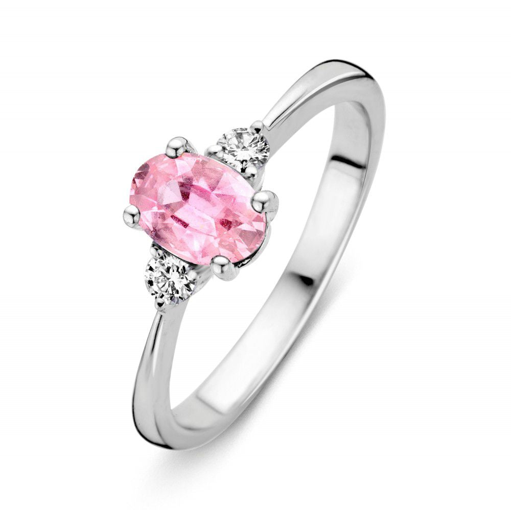 Anello in oro bianco con zaffiro rosa ovale e brillanti laterali.