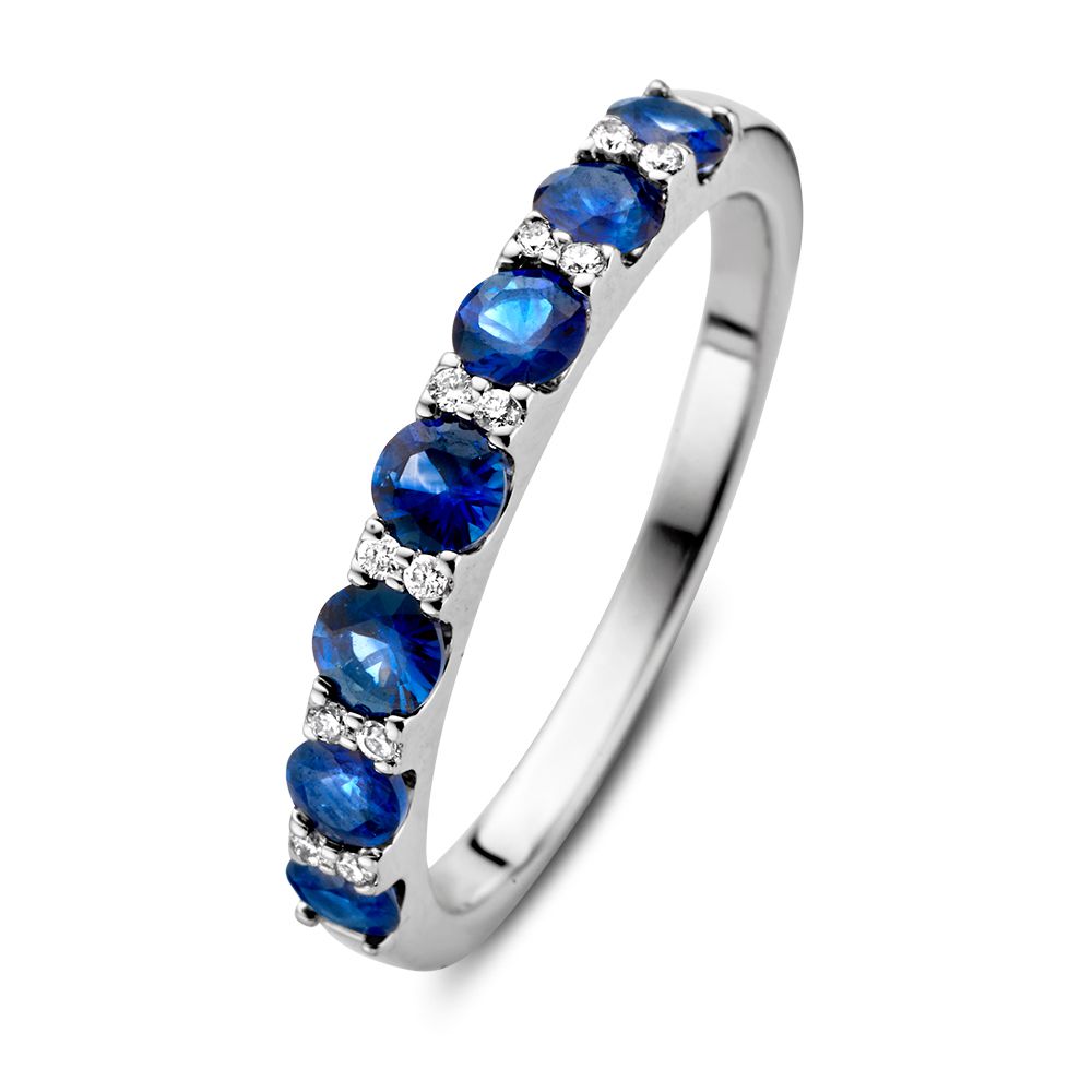 Anello in oro bianco 14 carati con zaffiri blu da 0,90 carati e diamanti da 0,06 carati.