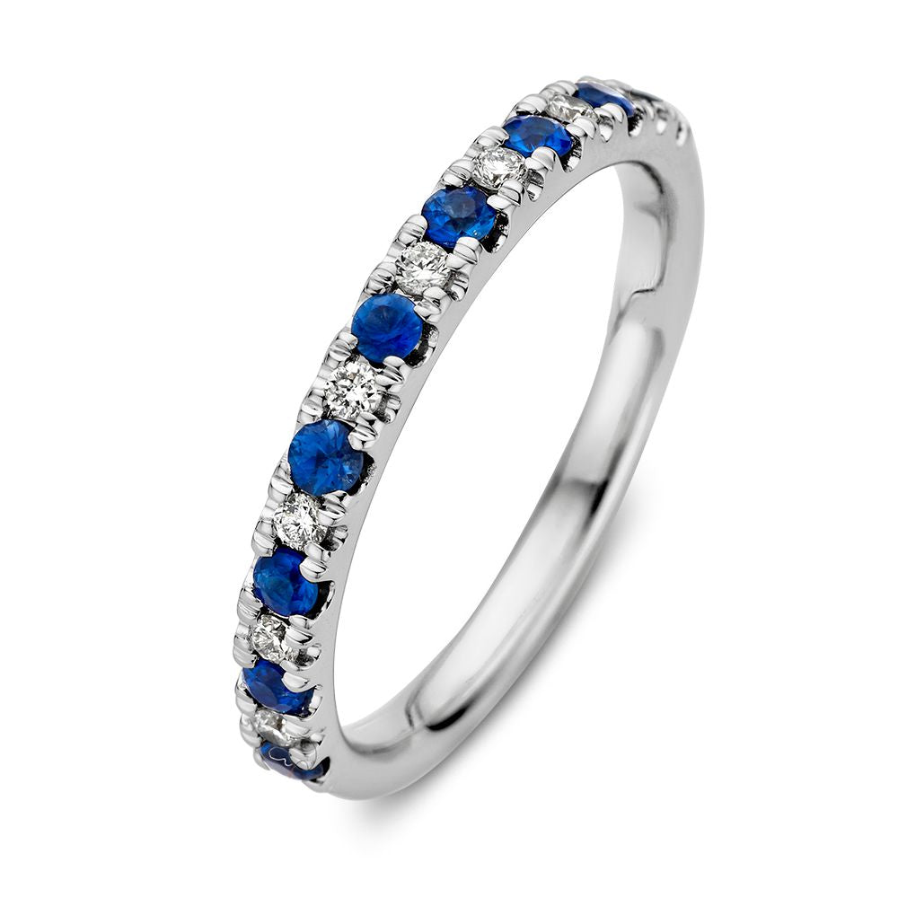 Anello in oro bianco 14 carati con zaffiri blu e diamanti da 0,14 carati.
