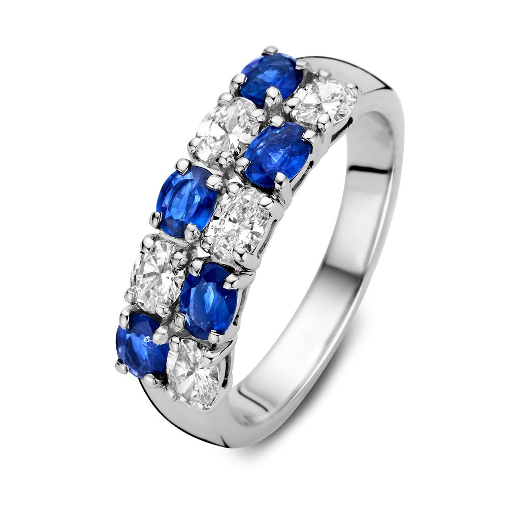 Anello in oro bianco 14 carati con zaffiri blu ovali e diamanti da 0,70 carati.