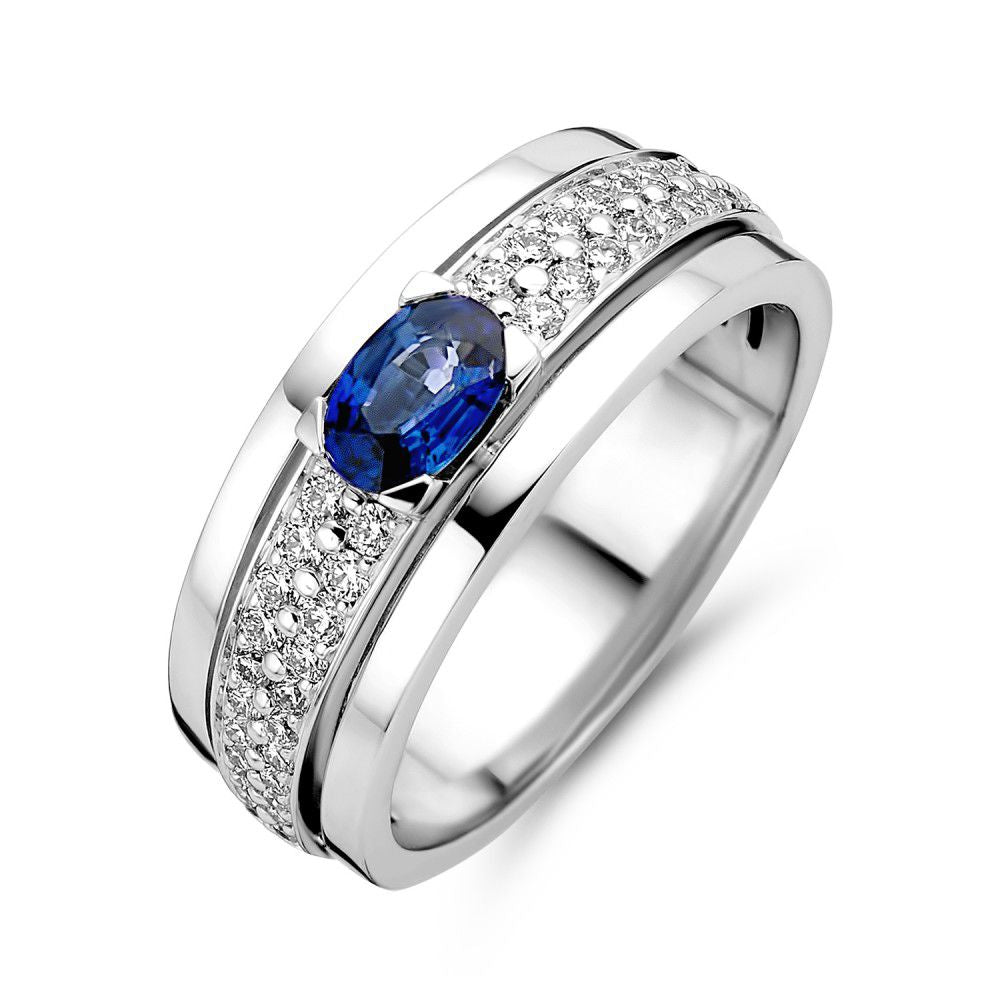 Anello in oro bianco da donna con zaffiro ovale e diamanti, design elegante con dettagli brillanti.