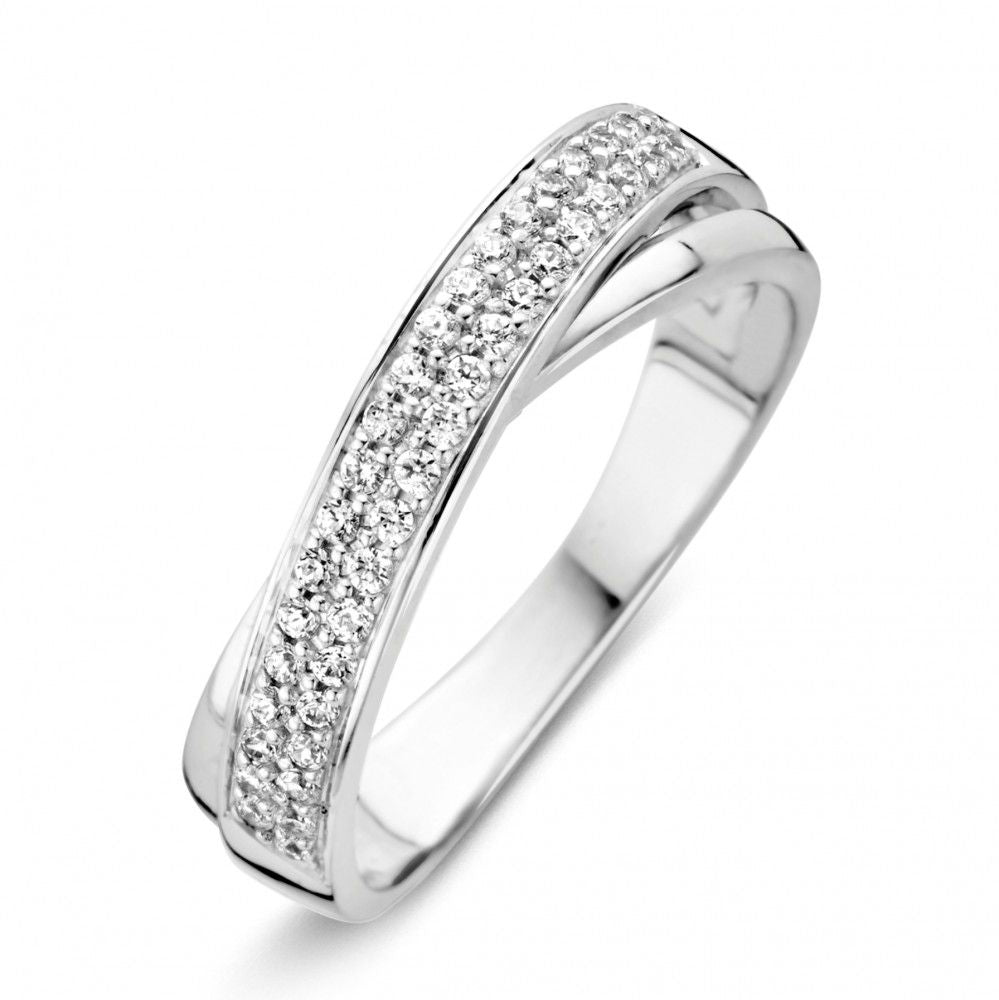 anello in oro bianco con zircone, design ondulato e finitura lucida.
