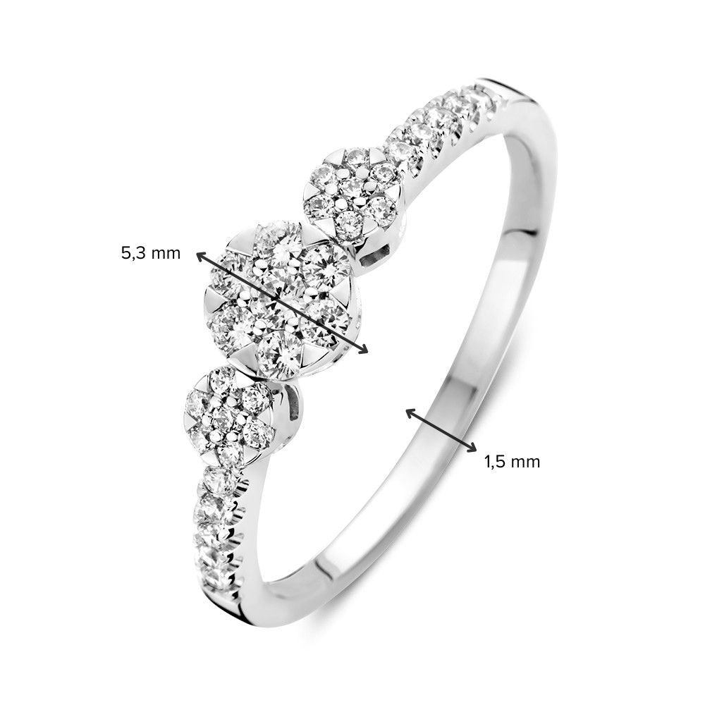 Anello a tre pietre in oro bianco con zircone e pietre laterali