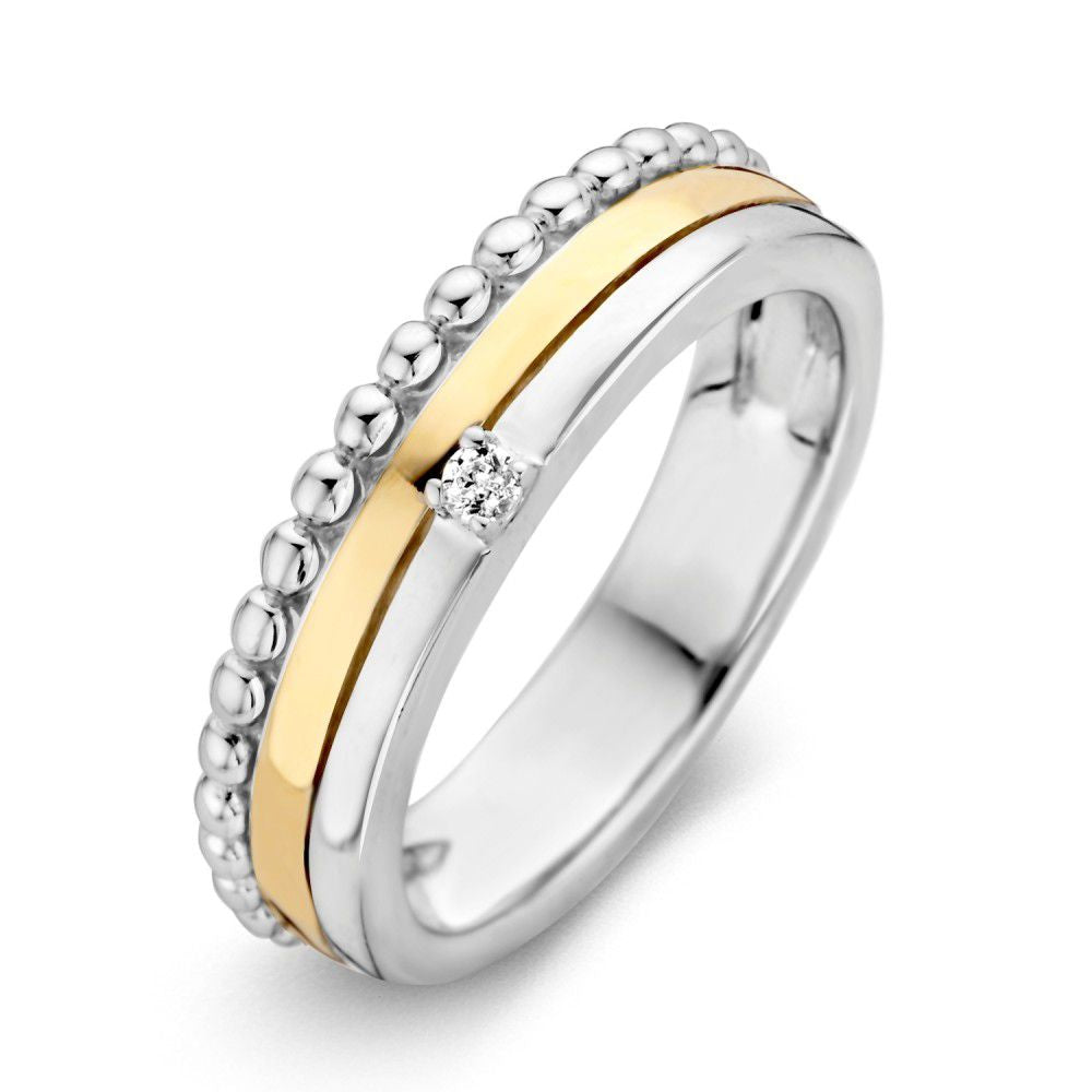 Anello in argento con dettagli in oro e zircone, con finitura lucida e design a bande.
