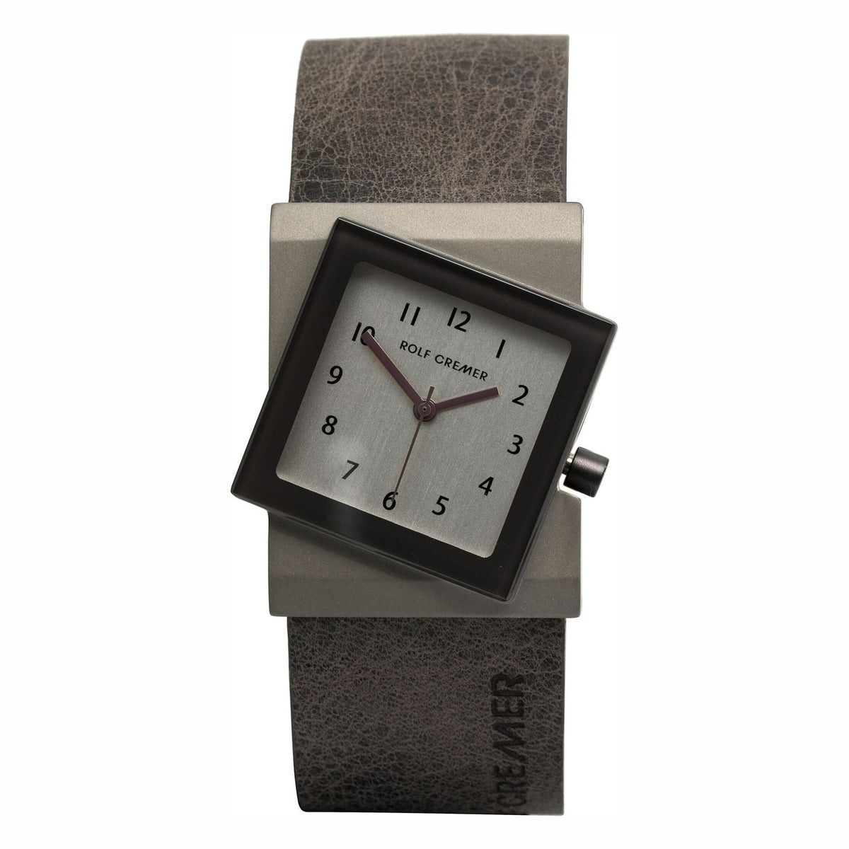 Orologio Rolf Cremer con quadrante quadrato grigio e cinturino in pelle marrone.