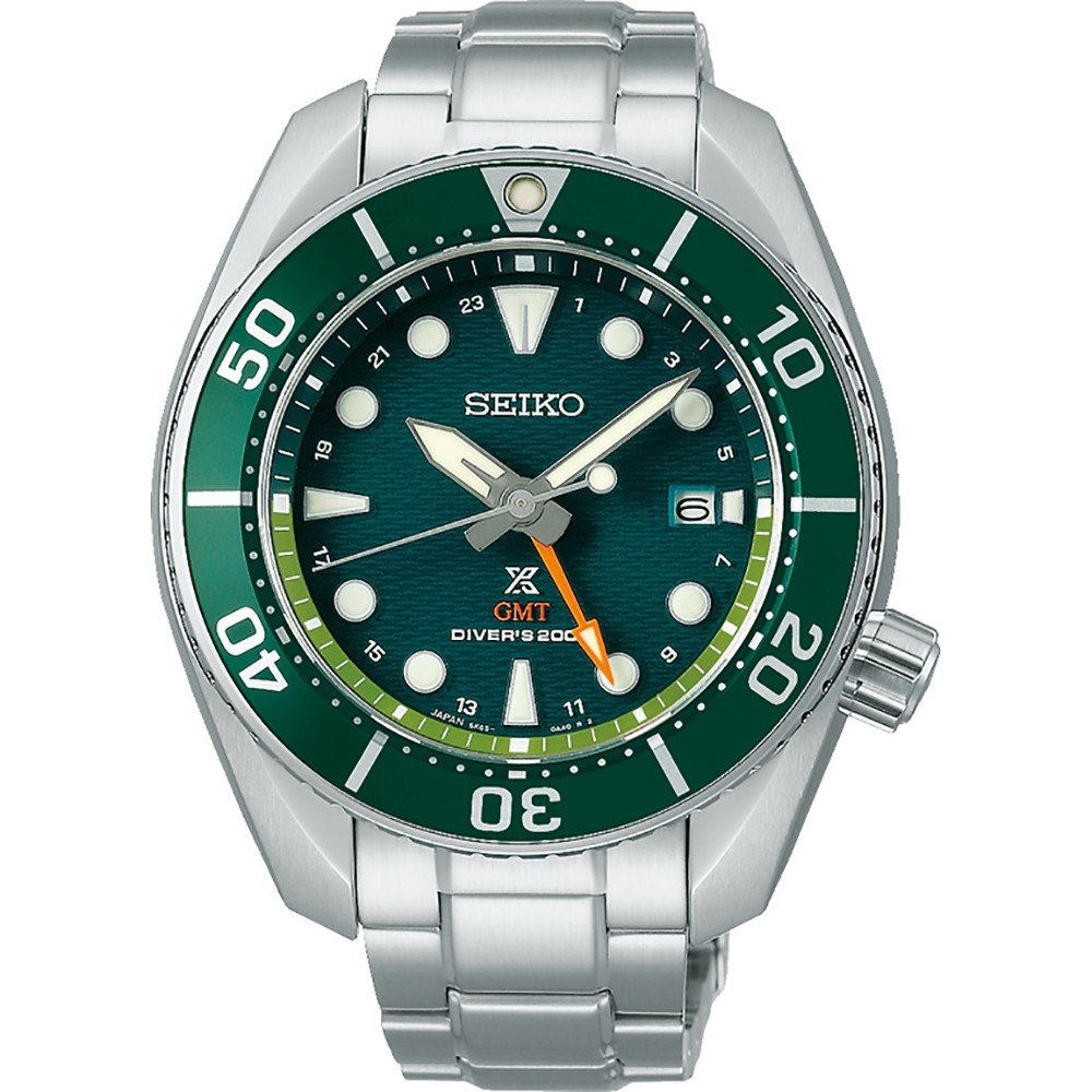 Het duikhorloge Prospex SFK003J1 van Seiko heeft een groene lunette, een blauwgroene wijzerplaat met structuur, lichtgevende markeringen, een datum op 3 uur, de tekst GMT Divers 200m en een roestvrijstalen band, en combineert precisie en stijl.