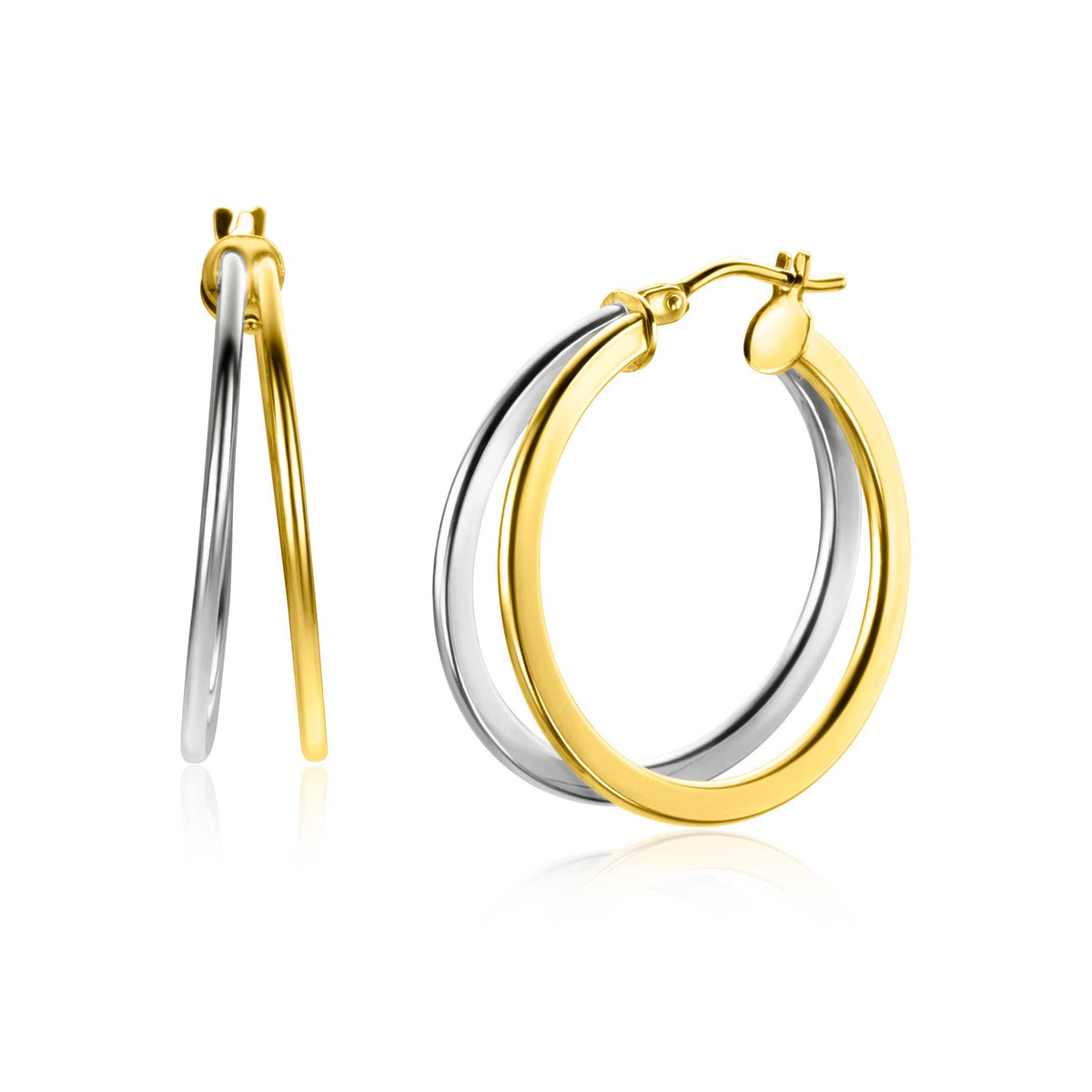 Orecchini alla creola in oro e argento con finitura lucida e design elegante.