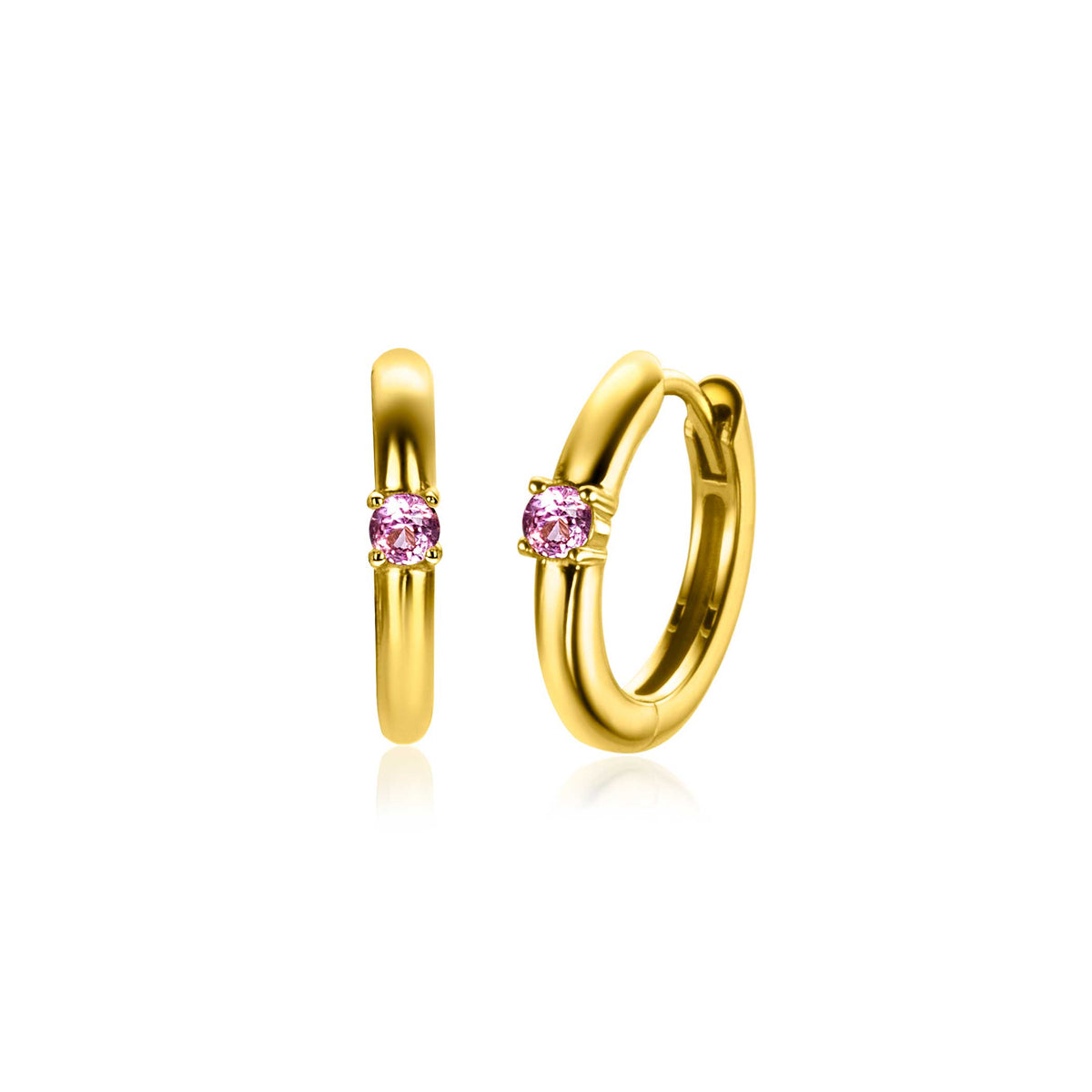 Orecchini in metallo dorato con pietra rosa centrale, forma a cerchio.