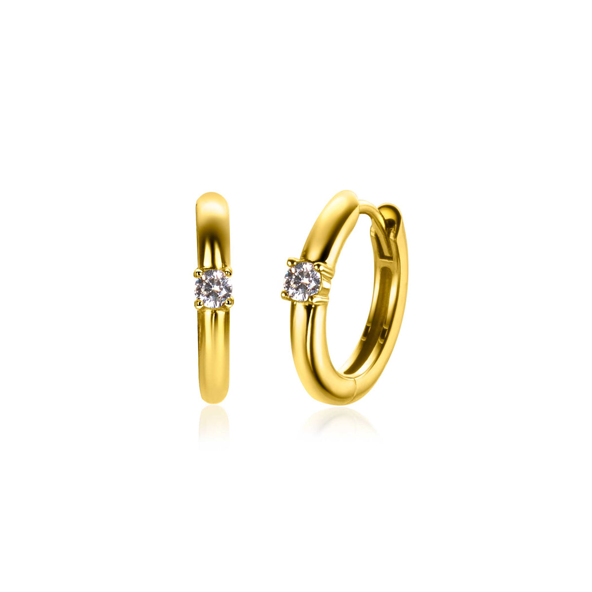 Orecchini in oro con un piccolo zircone incastonato, forma rotonda e finitura lucida.