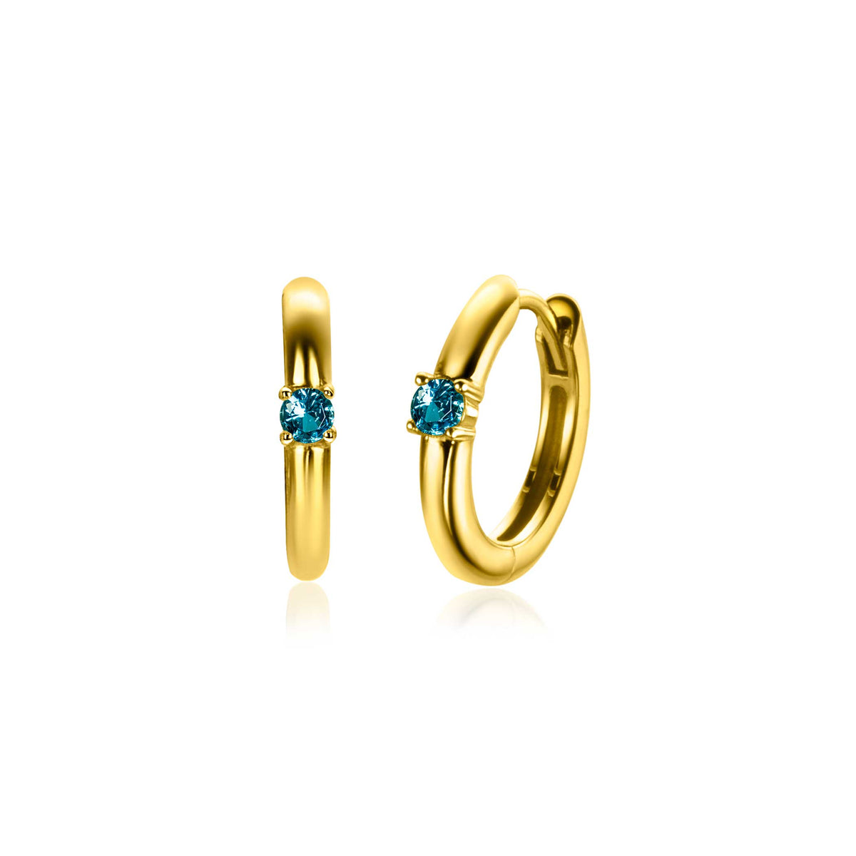 Orecchini in oro con pietra azzurra centrale, forma a cerchio e finitura lucida.