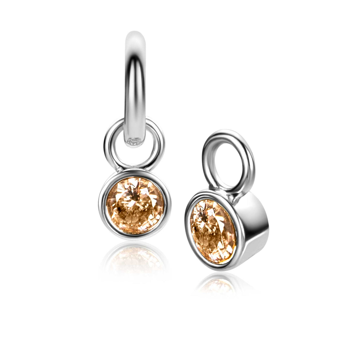 Orecchini in argento con pietra trasparente di colore ambra.