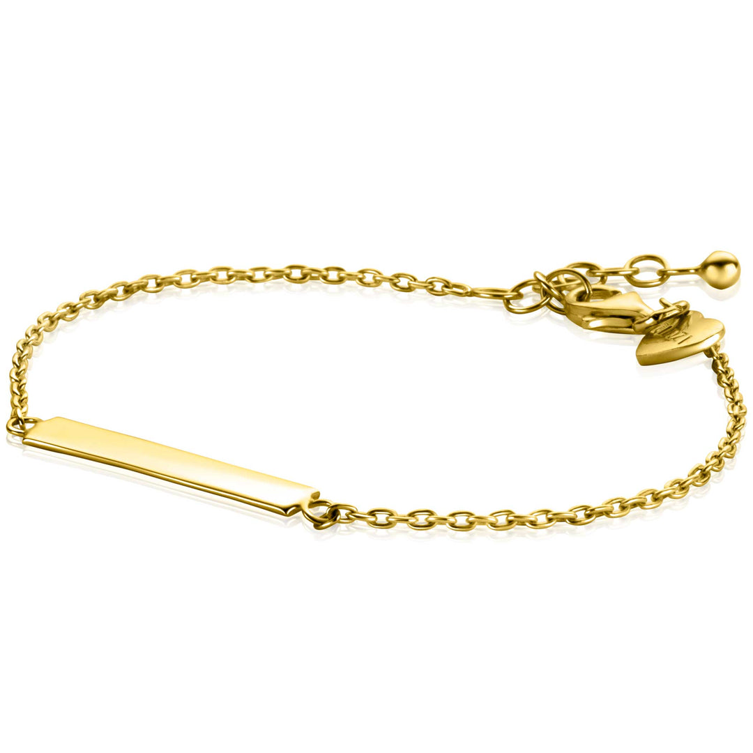 De Zinzi Armband Gold Plated Zia2344 G heeft een vergulde ketting met een graveerbaar rechthoekig plaatje, een charmant hart en een veilige sluiting, wat elegante eenvoud en gepolijste gouden schoonheid weerspiegelt.