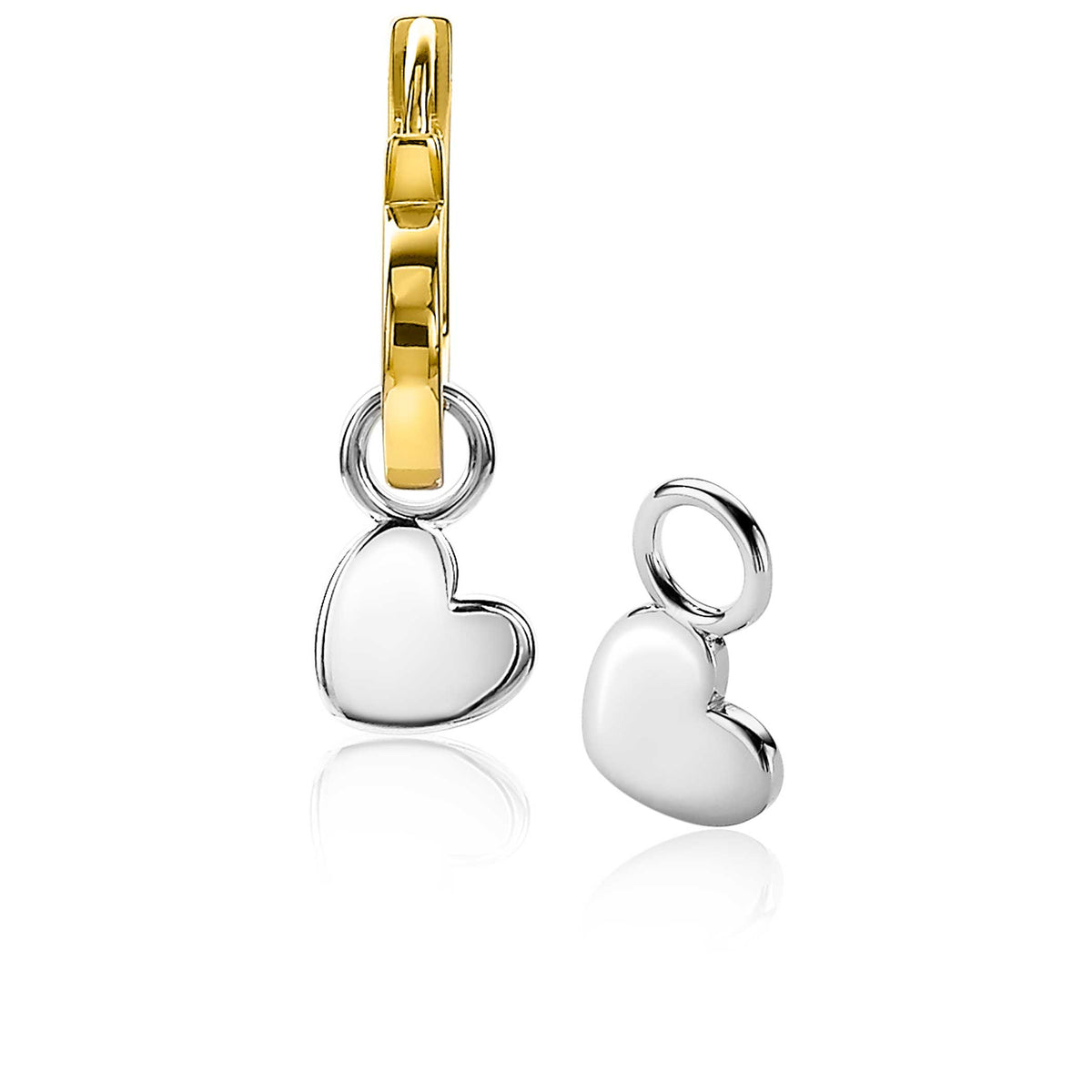 Orecchini in argento con pendente a forma di cuore e gancio dorato.