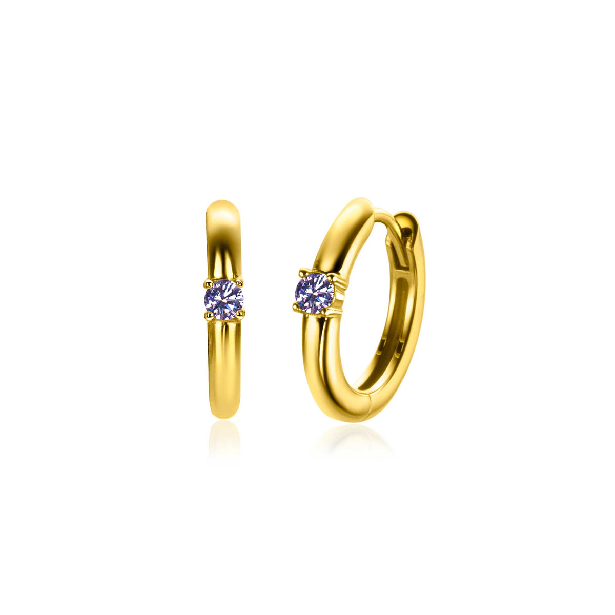 Orecchini in oro con un piccolo zircone centrale, forma rotonda e finitura lucida.