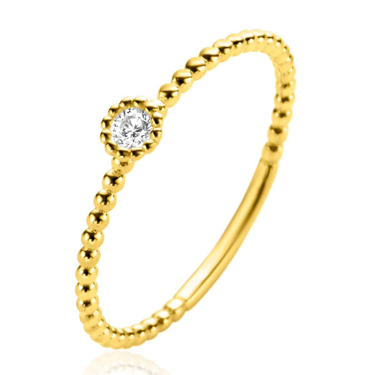 Anello dorato con un diamante centrale e finitura a pallini.