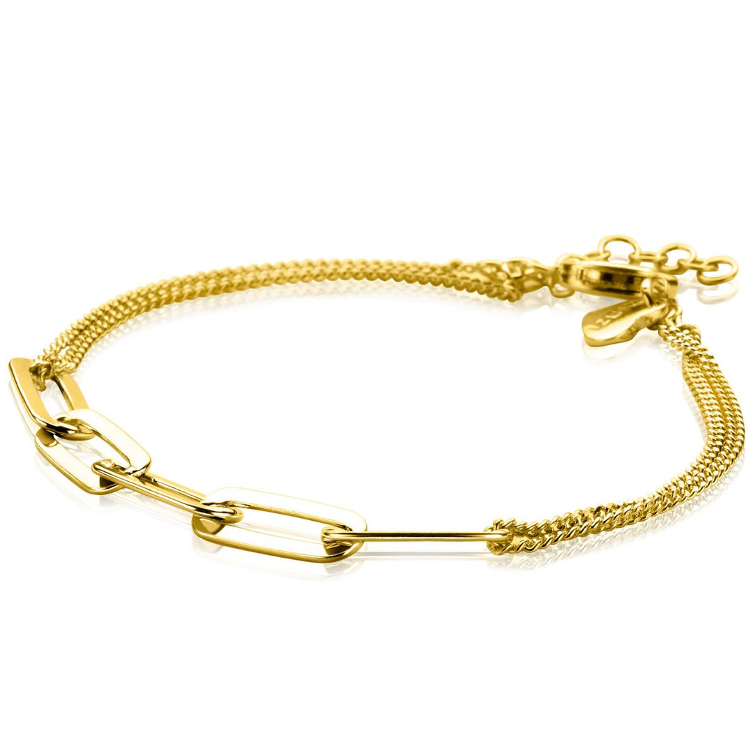Deze minimalistische en elegante gouden armband is voorzien van paperclipschakels en langwerpige rechthoekige schakels, compleet met een glanzende 14K geel vergulde afwerking en een verstelbare sluiting, in de stijl van de Zinzi Armband Gold Plated Zia2262 G.