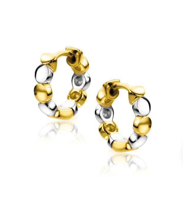 Orecchini in argento e oro con design a cerchio e dettagli ondulati.